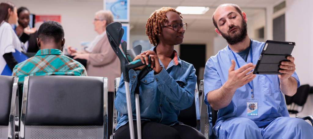 Doctor explaining patient care information on a tablet to improve patient throughput in hospitals.